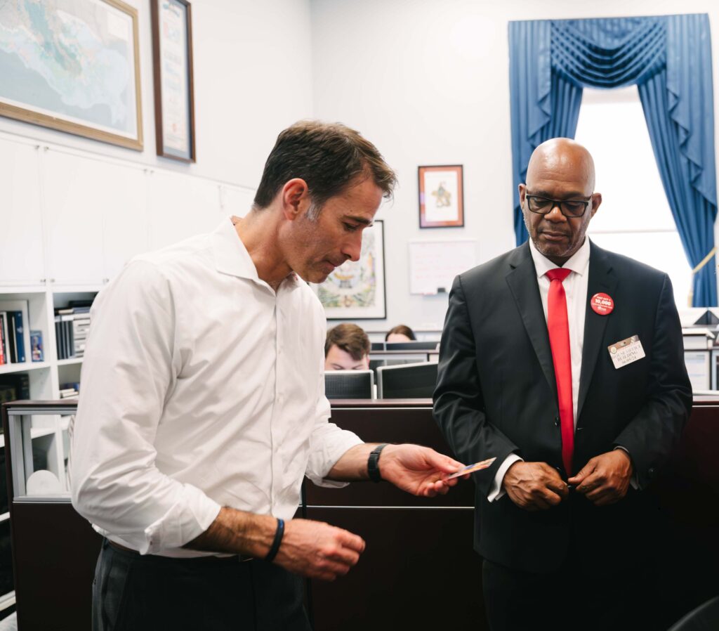 Members of MADD talking in an office